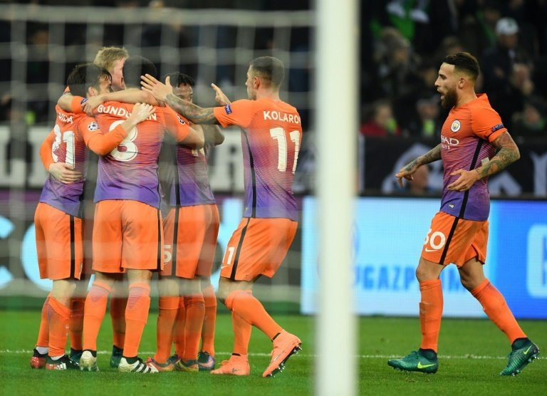 Manchester Citys players celebrate equalizing during the UEFA group C Champions League football match between Borussia Moenchengladbach and Manchester City on November 23, 2016