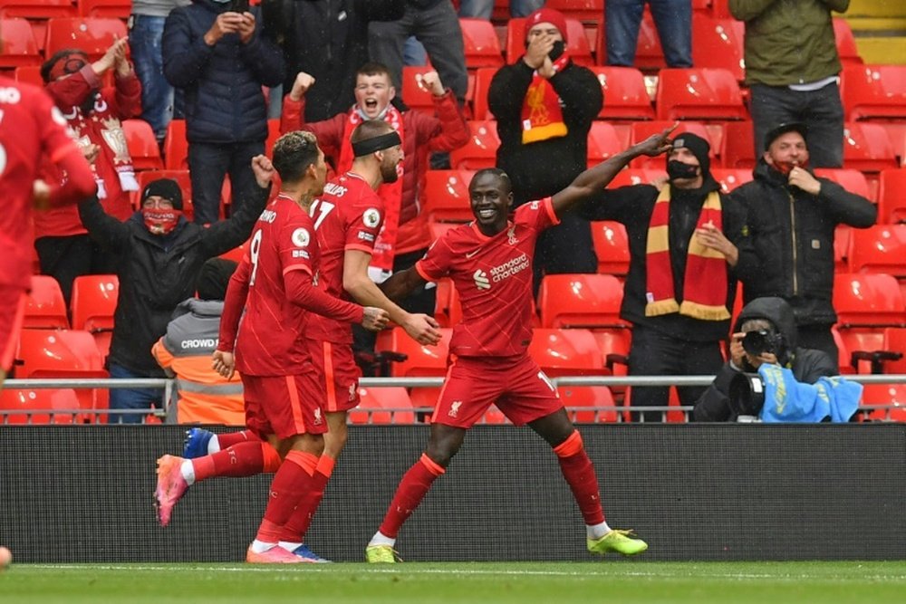 A brace from Sadio Mane (R) booked Liverpool's place in the Champions League. AFP