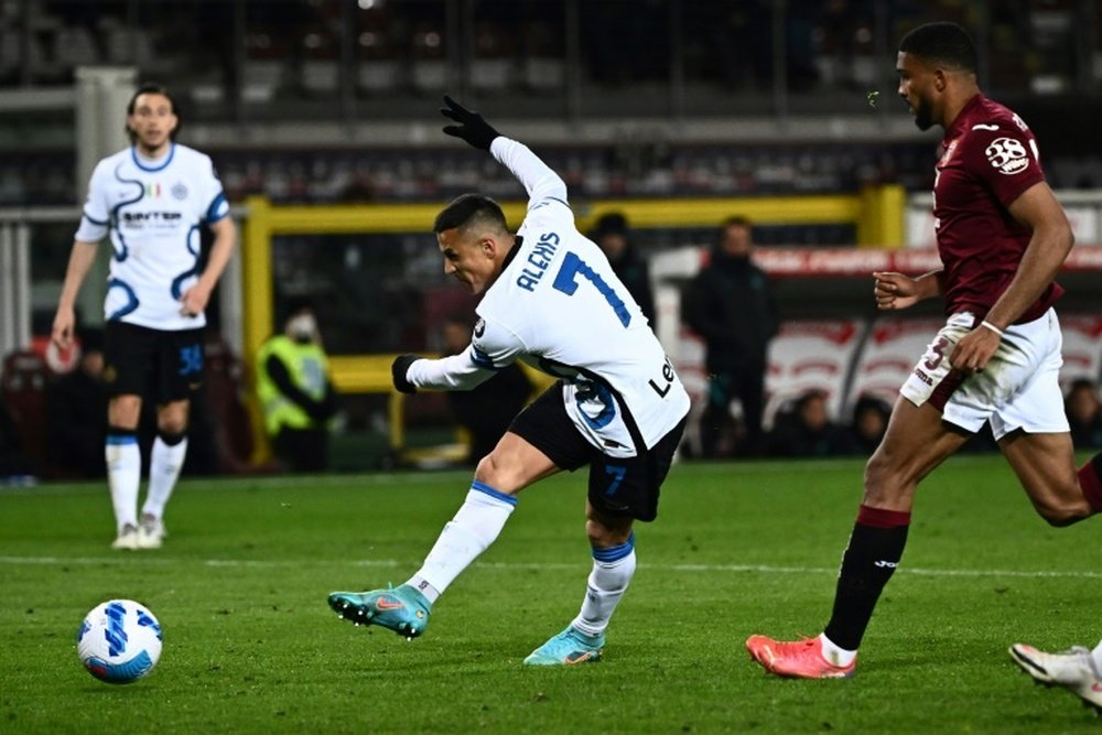 Alexis Sanchez saved Inters skin at Torino but his team trail AC Milan in the title race. AFP