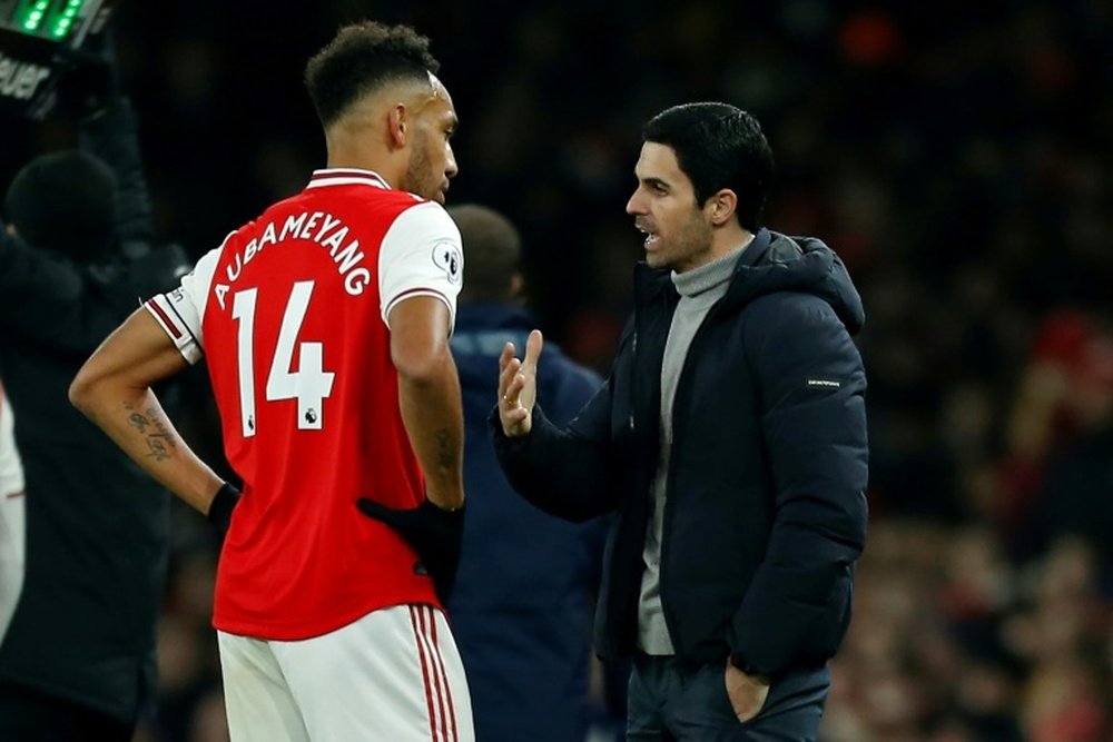 Aubameyang (L) strongly denies claims he is looking to leave Arsenal. AFP