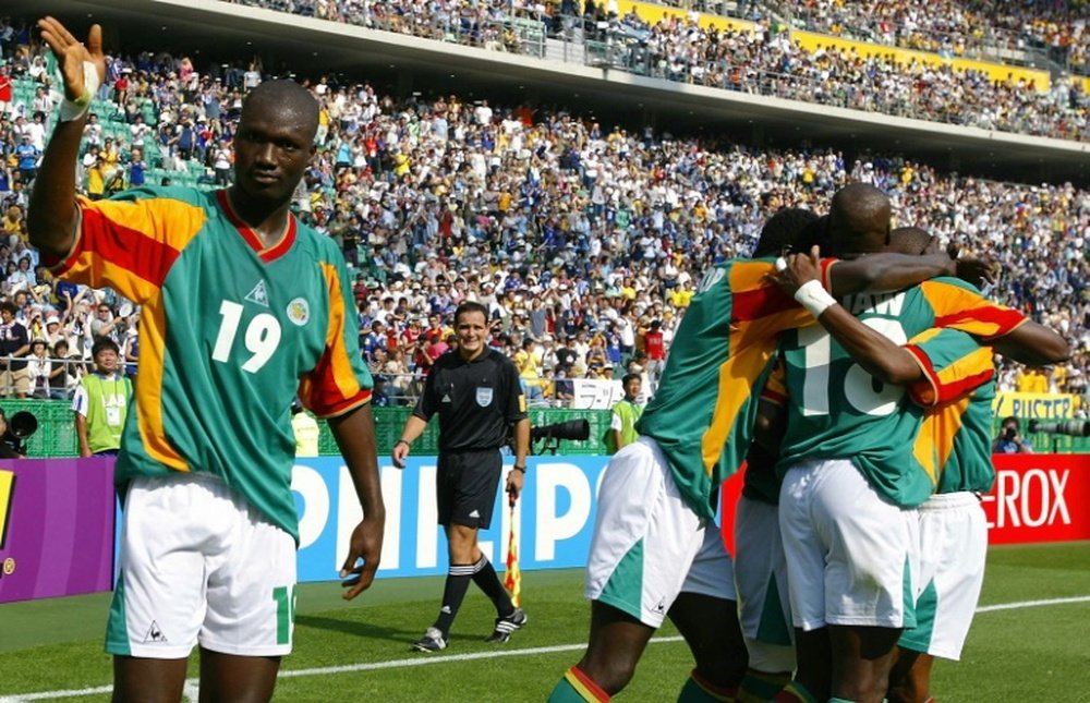 Papa Bouba Diop celebrates after a Camara goal against against Sweden at the 2002 World Cup. AFP
