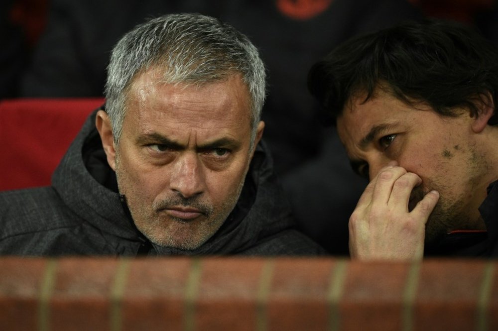 Jose Mourinho (L) talks with his assistant manager Rui Faria when the pair were at Man Utd.