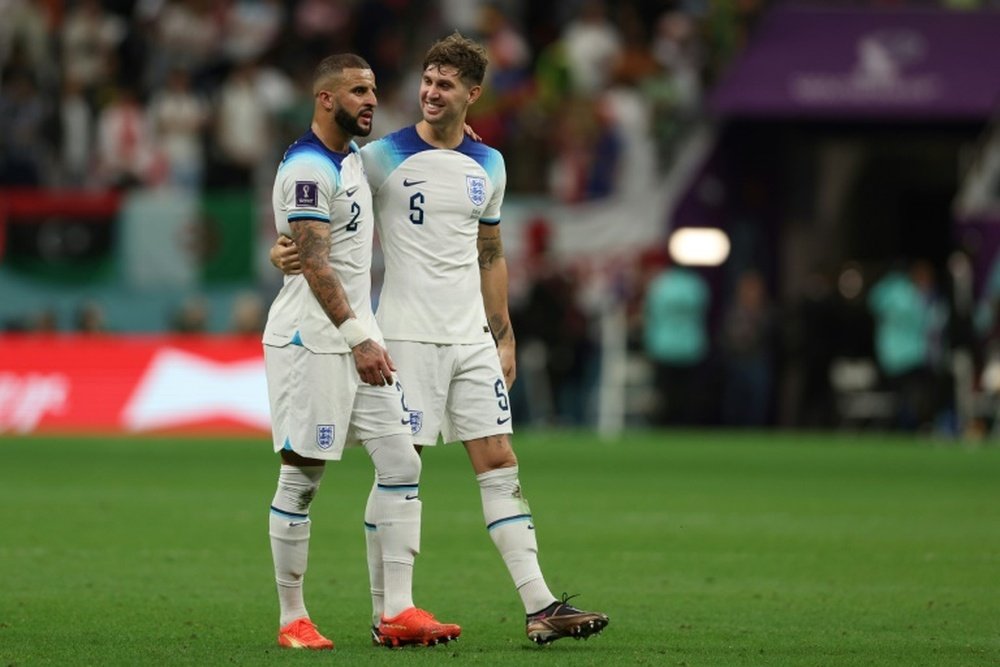 Walker (L) and Stones (R) have been ruled out of City's clash against Arsenal. AFP