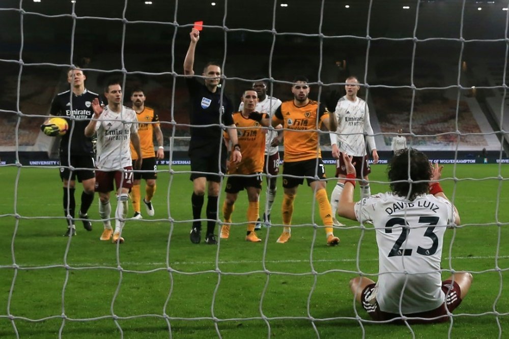 David Luiz was sent off as Arsenal were beaten 2-1 at Wolves. AFP