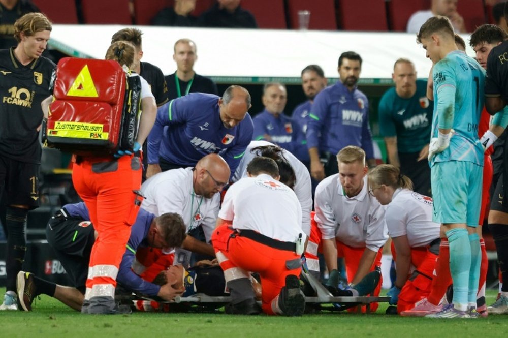 Robin Fellhauer was treated on the pitch during the loss to Bayern Munich. AFP