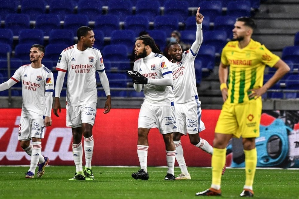 Ekambi scored as Lyon beat Nantes to stay top of Ligue 1. AFP