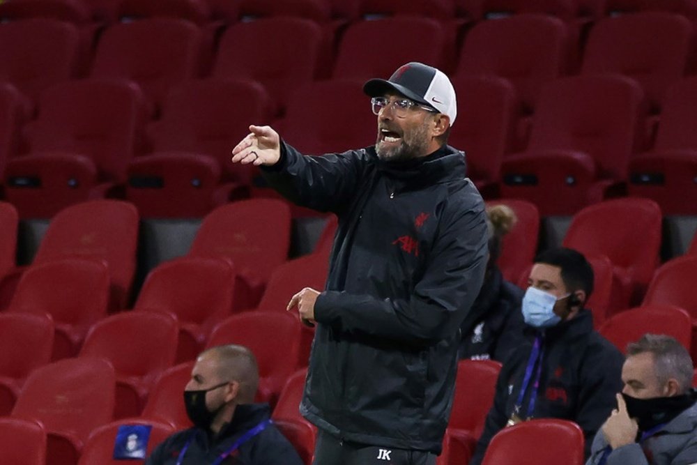 Jurgen Klopp is happy with Liverpool despite Van Dijk's absence. AFP