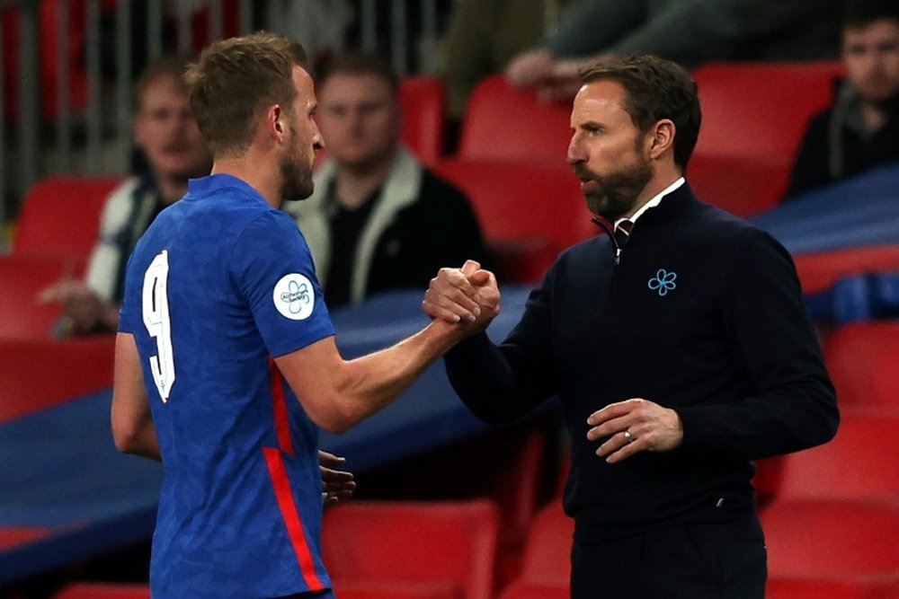 England manager Gareth Southgate shakes hands with Harry Kane. AFP