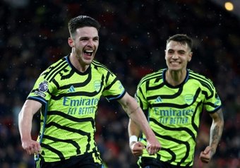 Arsenal entered the record books as a 6-0 demolition of Sheffield United on Monday kept the Gunners on Liverpool and Manchester City's tails in the Premier League title race.