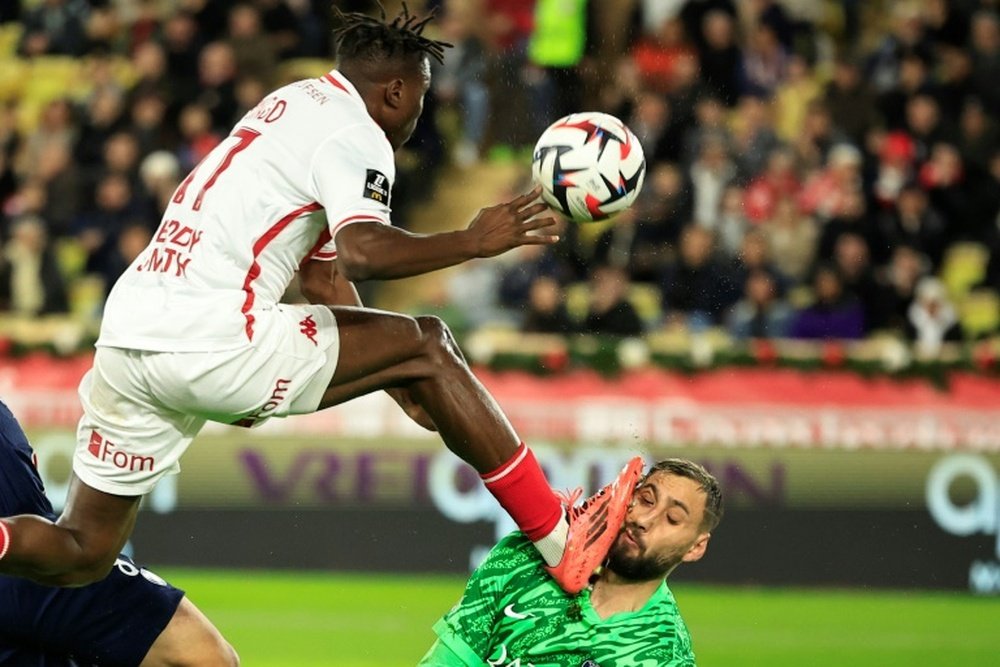 Gianluigi Donnarumma sustained an injury in a challenge with Wilfried Singo (L). AFP
