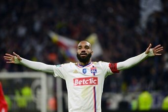 Alexandre Lacazette scored twice as Lyon defeated second-tier Valenciennes 3-0 on Tuesday to reach the French Cup final, where they will face either Paris Saint-Germain or Rennes.