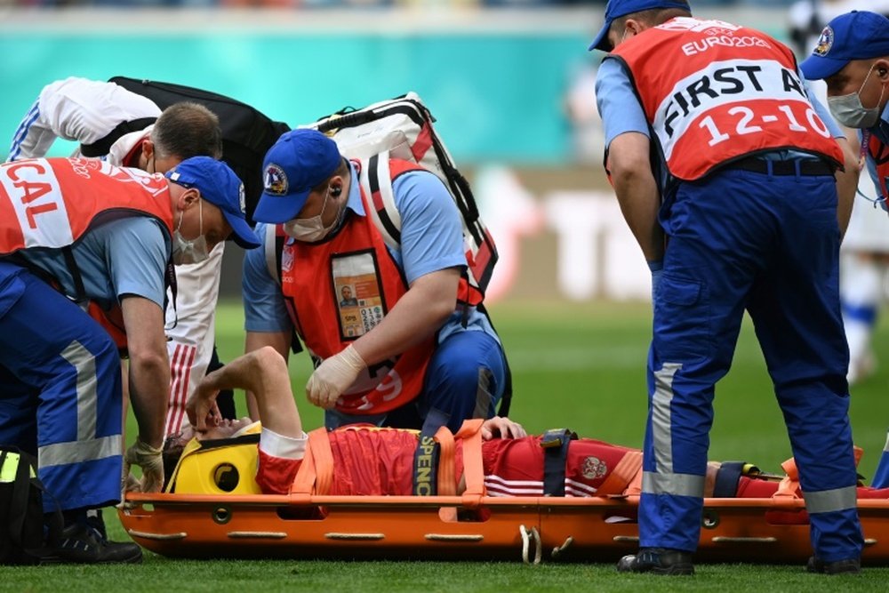 Mario Fernandes had to go off on a stretcher. AFP