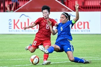 The Philippines women's football team battled to a 2-1 win over rivals Vietnam Tuesday in the meeting of their region's two World Cup-bound teams, but still crashed out of the Southeast Asian Games on goal difference.