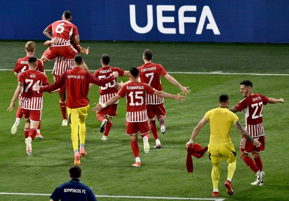 Olympiakos players celebrate after winning the UEFA Europa Conference League final. AFP