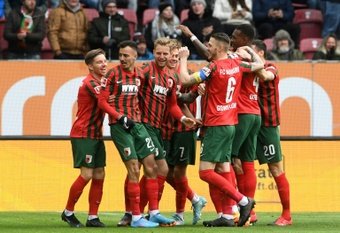 Iago (2L) scored after just 51 seconds for Augsburg. AFP