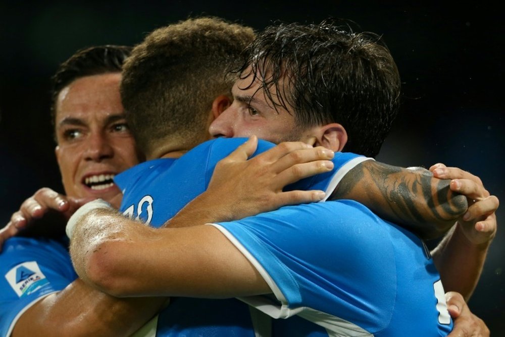 Di Lorenzo (C) and Kvaratskhelia (R) scored Napoli's goals against Bologna. AFP