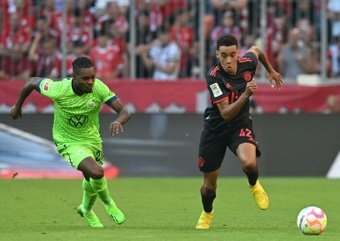 Jamal Musiala (R) netted in Bayern Munich's victory over Wolfsburg. AFP