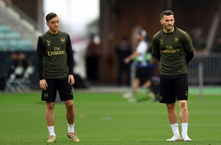 Two charged over security incident linked to Arsenal duo