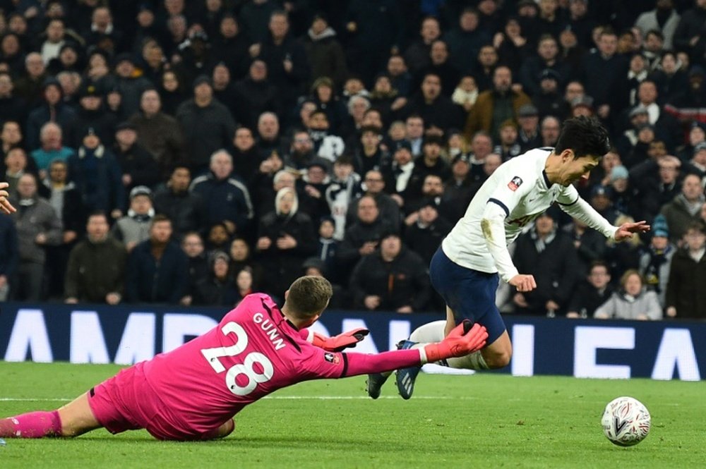 Son late show sends Spurs into FA Cup fifth round. AFP
