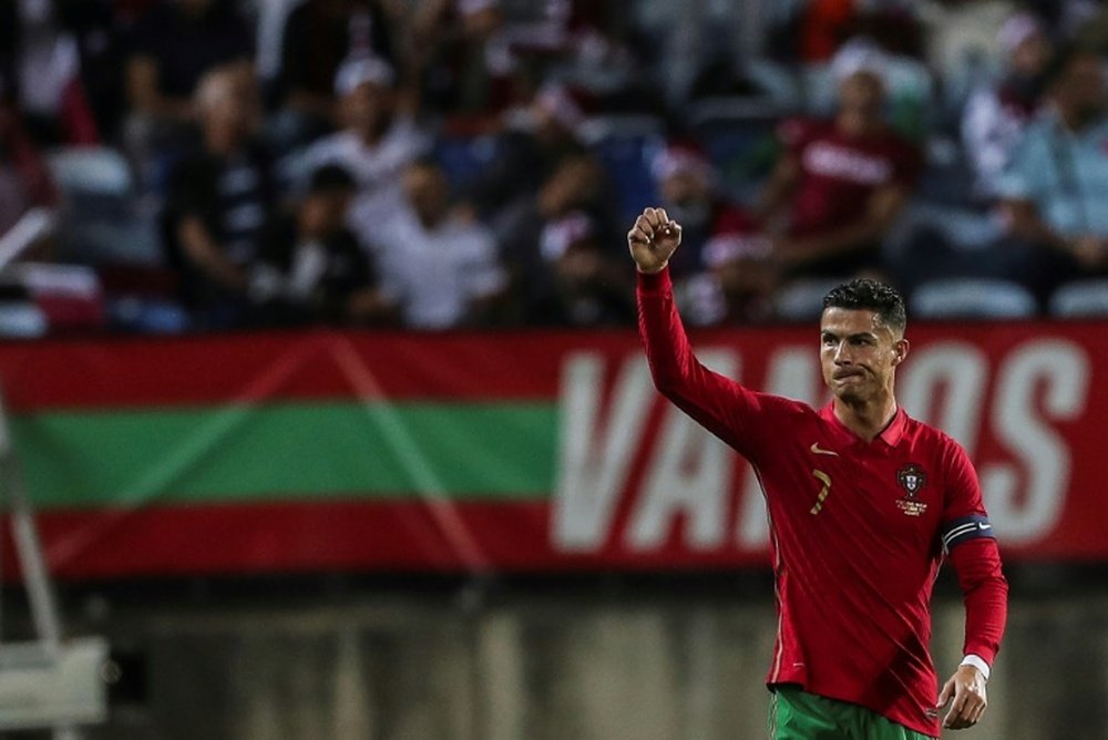 Cristiano Ronaldo celebrates after scoring against Qatar. AFP