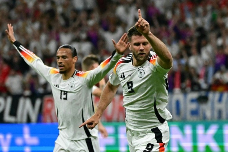 Fuellkrug's late header earned Germany a spot in the last 16. AFP