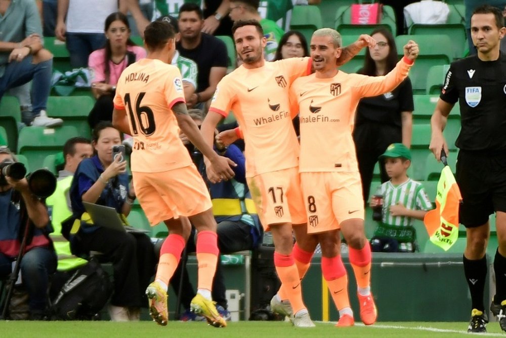 Antoine Griezmann (R) got a brace as Atletico Madrid won at Real Betis. AFP