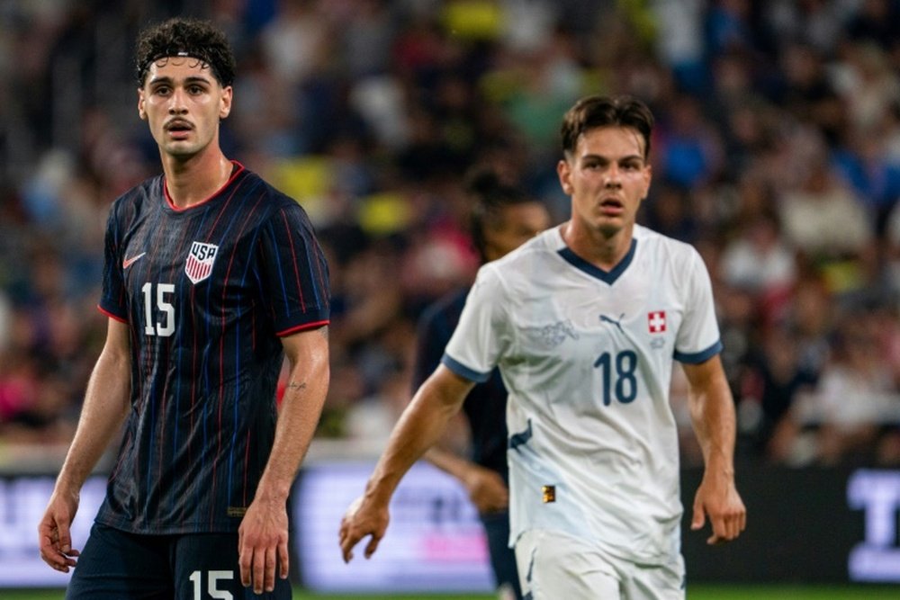 Cardoso (L) became the first player from the United States to sign for Atletico. AFP