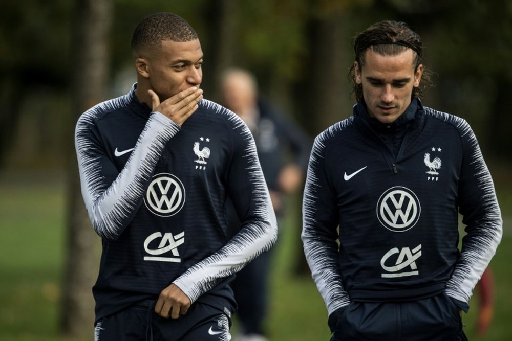 Mbappe (L) has pulled out of the France squad as he is not fit. AFP