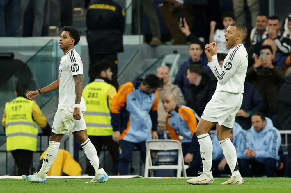 Real Madrid's French forward Kylian Mbappe (R) scored the opening goal against Sevilla. AFP