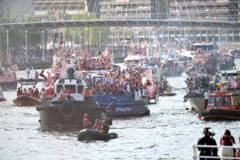 Athletic Bilbao fans flooded the streets of their city on Thursday to celebrate the team's Copa del Rey triumph, their first major trophy for 40 years, paraded down the Nervion river on a boat.