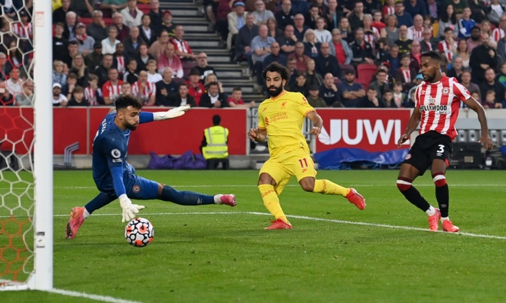 Mohamed Salah scores for Liverpool in a 3-3 Premier League draw at Brentford. AFP