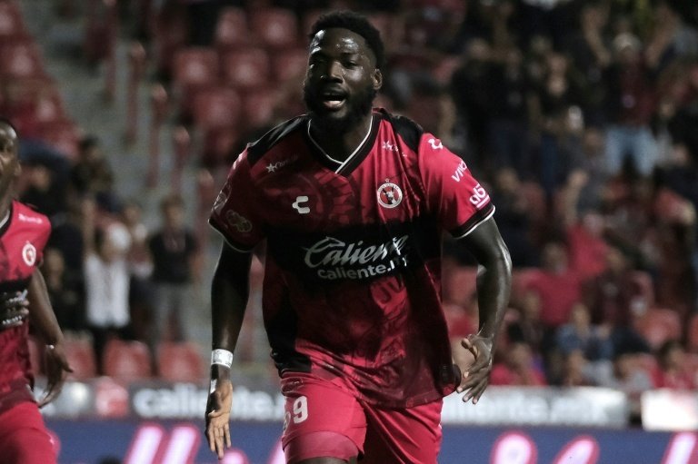 Jamaica beat Bermuda 4-0 on Tuesday to seize the lead in Group B of CONCACAF World Cup qualifying as Curacao slipped to second after a 1-1 home draw against Trinidad and Tobago.