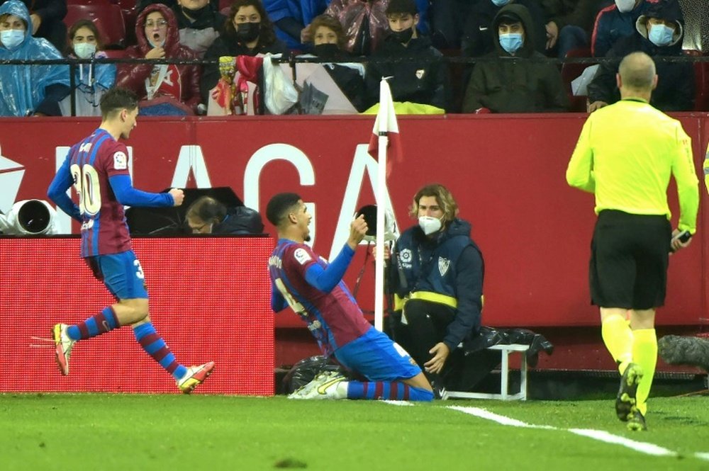 Barcelona defender Ronald Araujo celebrates scoring the equaliser against Sevilla. AFP