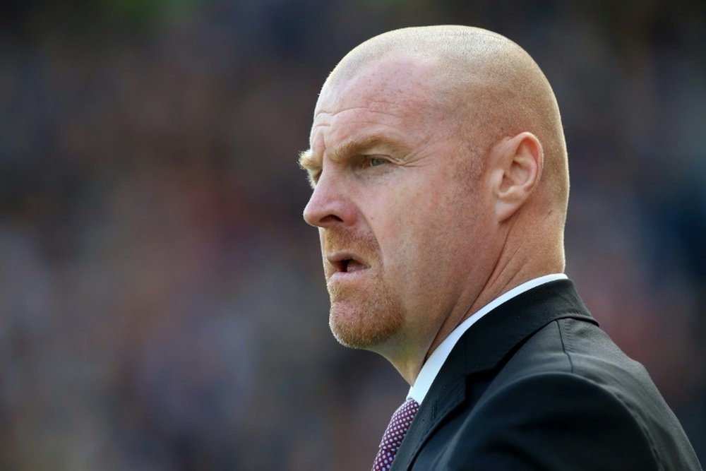 Sean Dyche wants Burnley to keep up with their rivals. AFP