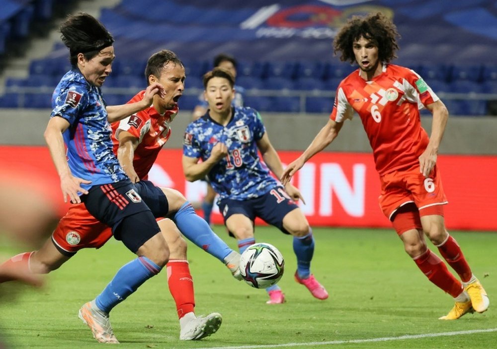 Japan forward Takumi Minamino (L). AFP