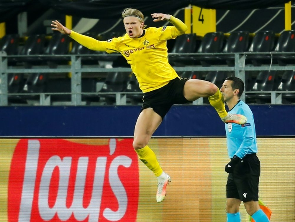 Erling Haaland (R) scored twice to send Dortmund into the quarter-finals. AFP