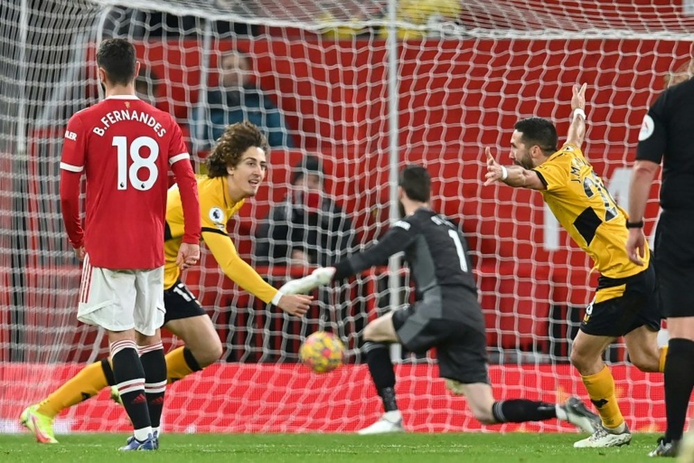 Joao Moutinho (R) gave Wolves a deserved victory at Man Utd. AFP