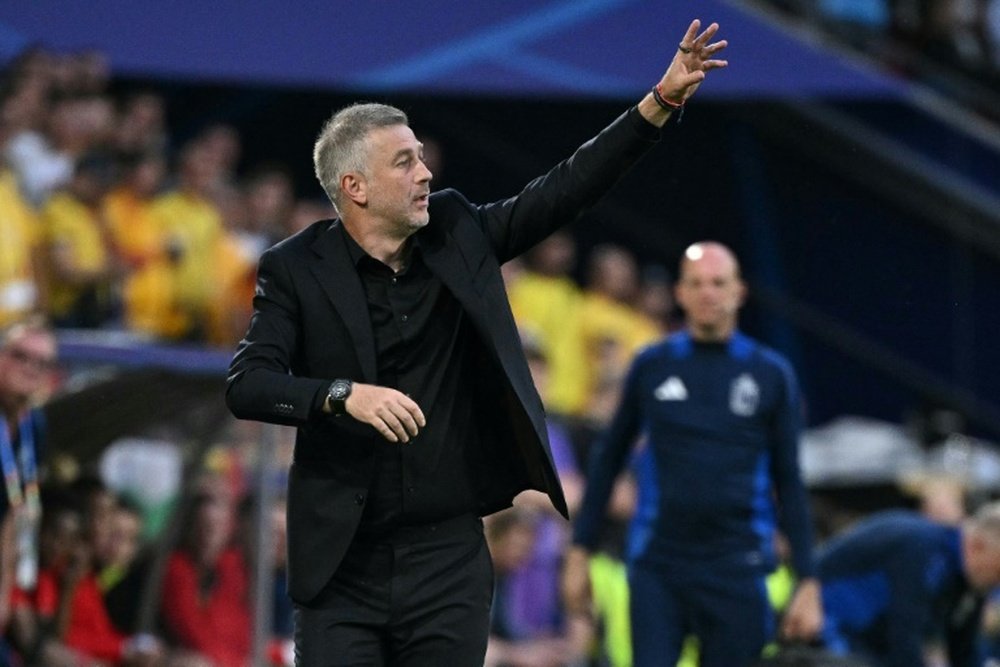 Romania will be guaranteed to reach the last 16 if they avoid defeat against Slovakia. AFP