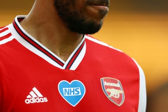 Arsenal will swap their red shirts for white to promote an anti-knife crime campaign. AFP