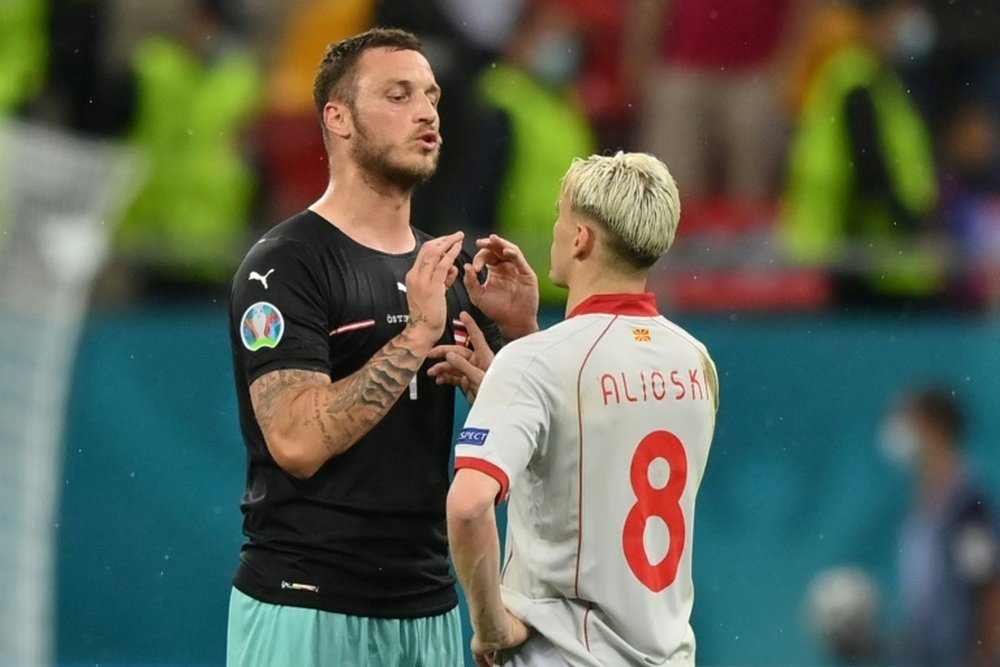 Arnautovic (left) confronts North Macedonia's Alioski in the match in Bucharest on Sunday. AFP