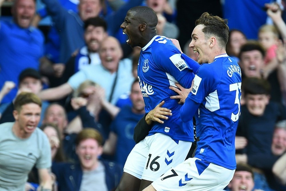 Doucoure (L) scored the goal which kept Everton in the Premier League. AFP