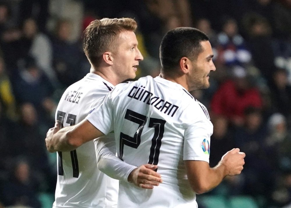 Gundogan (R) was the hero for Germany in Tallinn. AFP