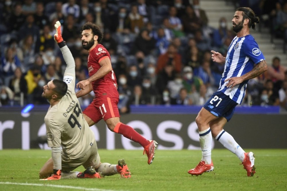 Liverpool thrash Porto to go top of the table with six points. AFP