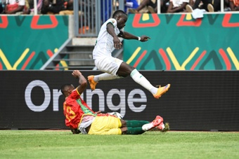 Sadio Mane evades a tackle by Guinea defender Issiaga Sylla during an Africa Cup of Nations. AFP