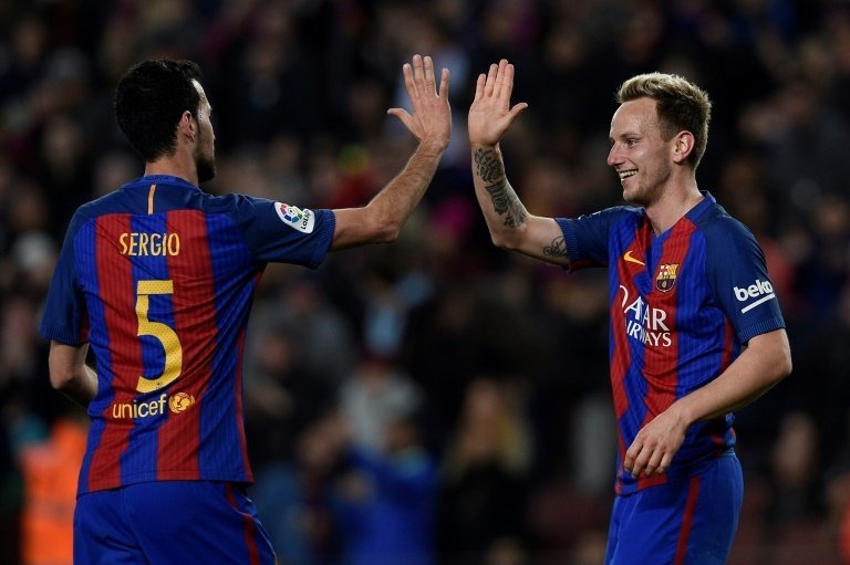 Ivan Rakitic has extended his deal with Barca. AFP