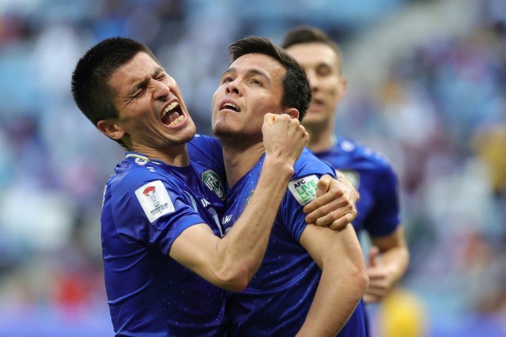 Uzbekistan eased through to the Asian Cup last 16. AFP