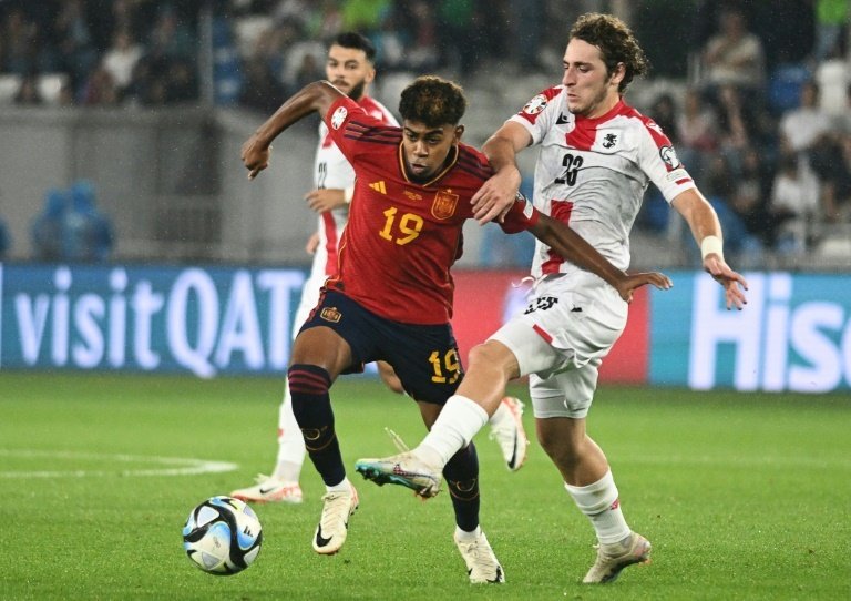 Yamal (L) came on for his debut and scored in the thrashing of Georgia in Euro 2024 qualifying. AFP