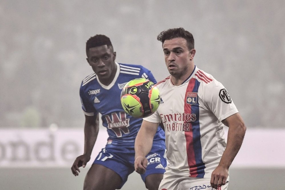 Xherdan Shaqiri (R) made his Lyon debut in the win over Strasbourg. AFP