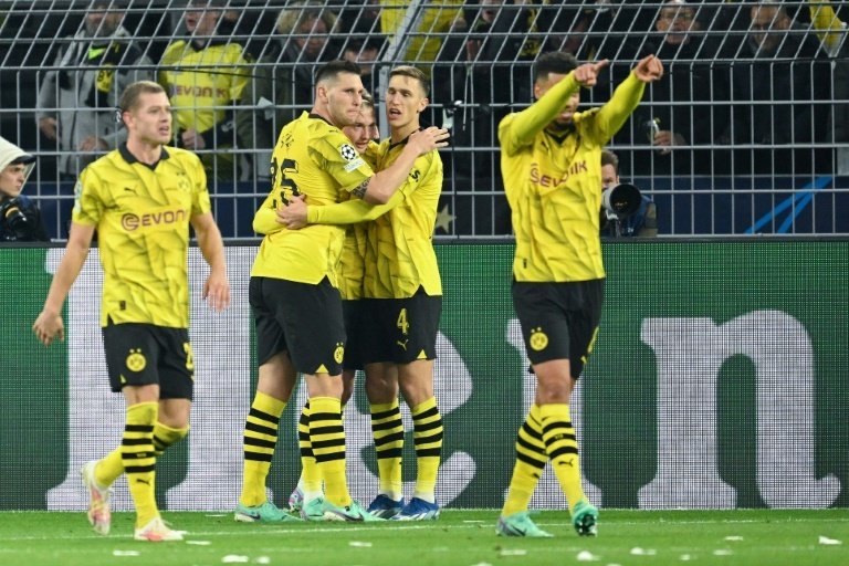 Dortmund go top of a difficult Group F with two games remaining. AFP