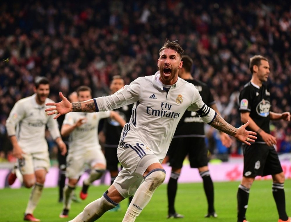 Real Madrids defender Sergio Ramos celebrates after scoring against Deportivo at the Santiago Bernabeu stadium in Madrid on December 10, 2016